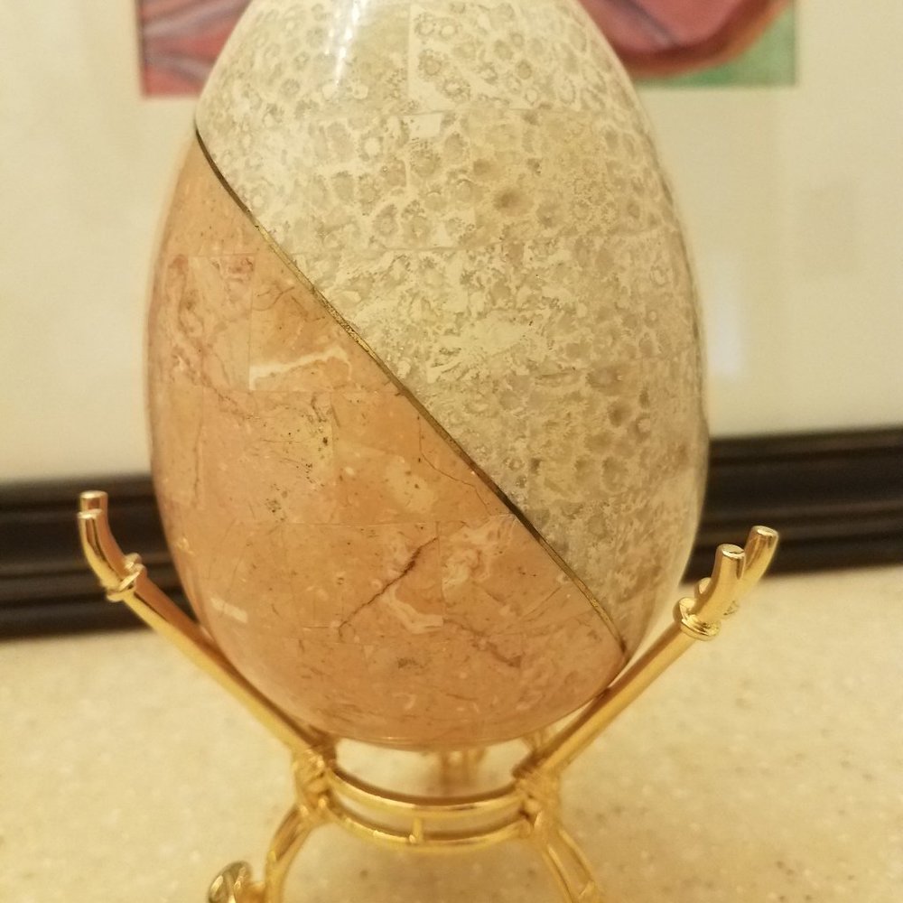 Stone ostrich stone mosaic egg with gold inlay.